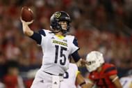 Cookus drops back to pass in a 2017 game against Arizona (Photo: Getty)